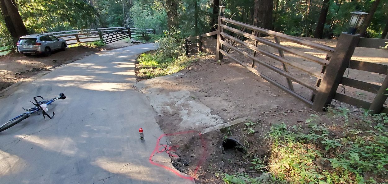 Seems cars cut the corner driving over this dirt area when passing